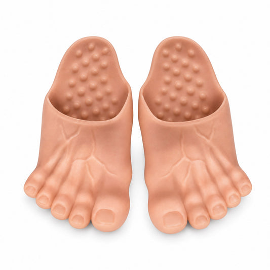 DawgzOut Giant Foot Slippers in skin tone, pair of oversized foot-shaped slippers with five toes and toenails